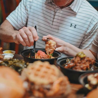 People having food at the table.
