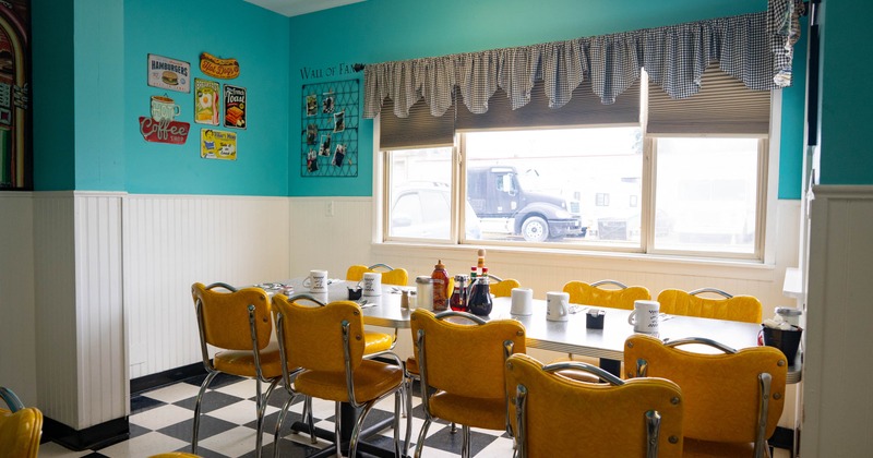 Interior, long table, yellow chairs, and vintage decor