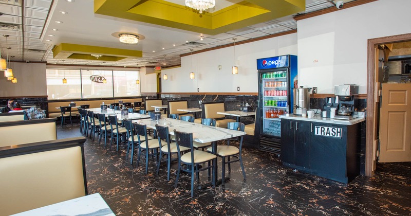 Interior seating area with chairs, tables and booths