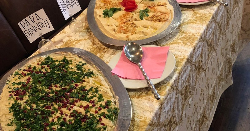 Baba ghanoush and hummus tray on a buffet table