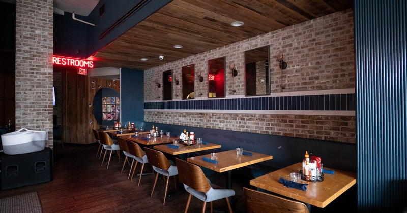 Interior, dining area with guest tables, chairs and bench seats