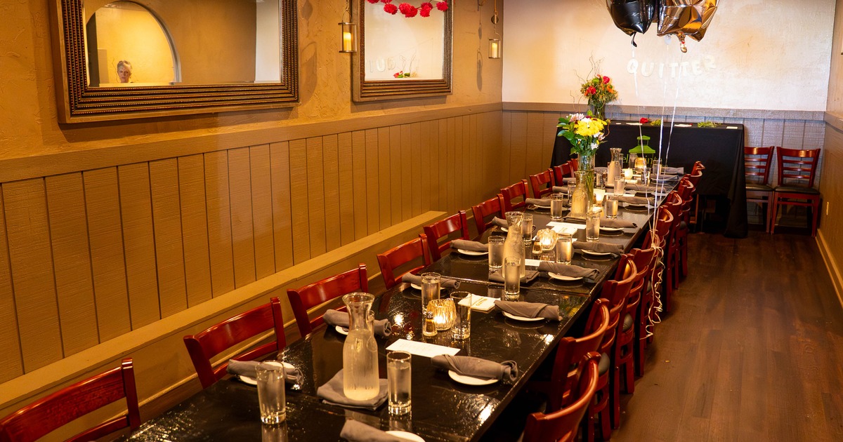 Interior seating area with a long table and chairs