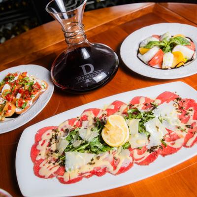 Various food and a decanter of wine.