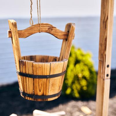 Hanging wooden bucket.