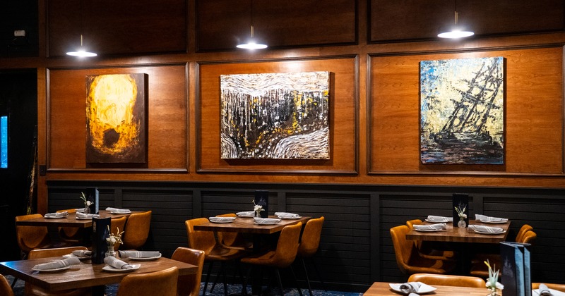 Modern style of dining area interior design with set tables ready for guests