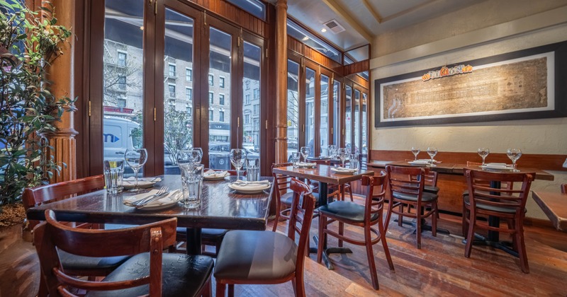 Interior, tables and chairs next to the windows