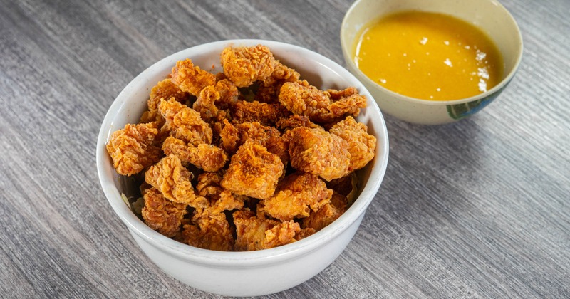 Mango Chicken Bites served with a dipping sauce