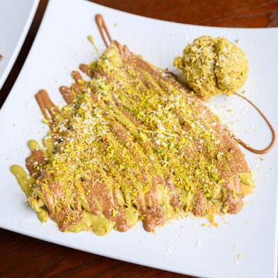 Dubai Chocolate Crepe served with a scoop of pistachio ice cream.
