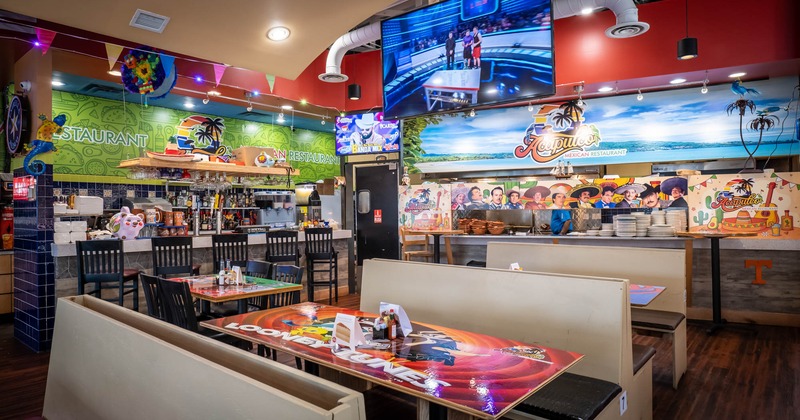 Interior, seating area with a bar on the left and ordering counter on the right