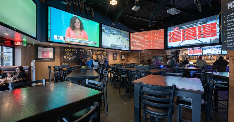 Interior, tables and chairs, guest sitting in the back