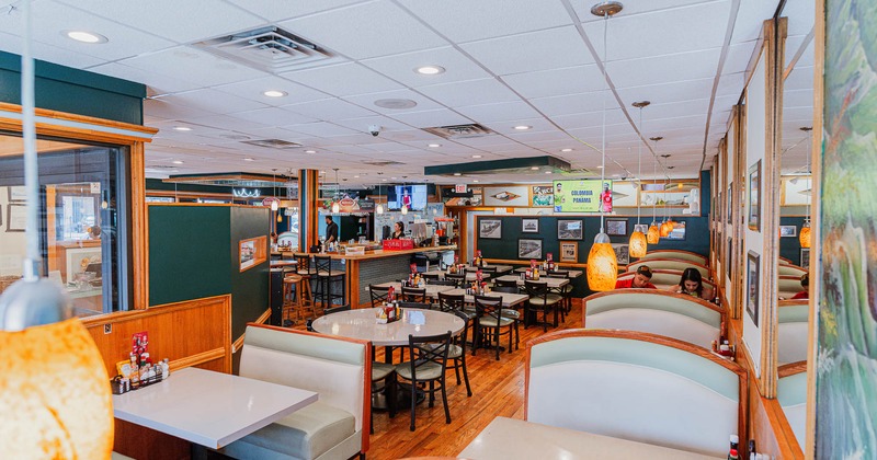 Interior, dining area with bar behind