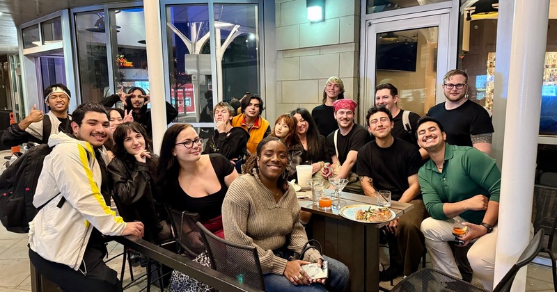 Large group of guests posing for a picture