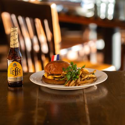 American burger served with fries and beer.