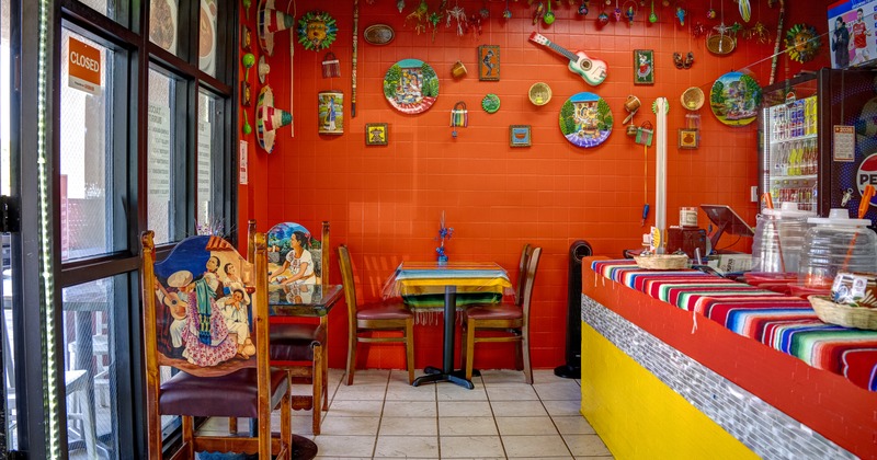 Interior, seating area with colorful furniture and wall decorations