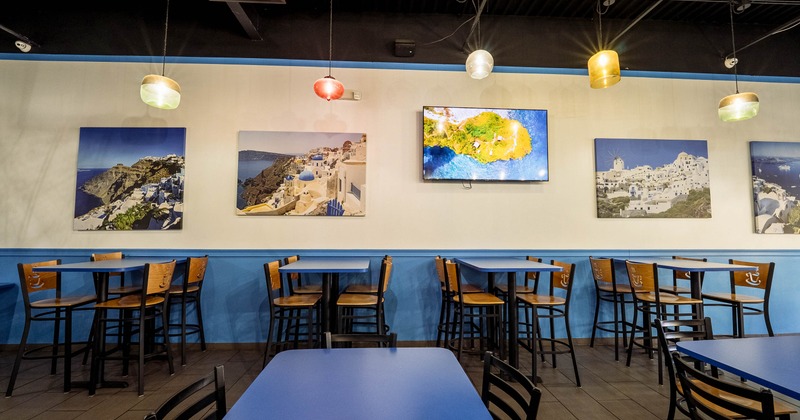 Interior, tables and chairs with pictures on the wall