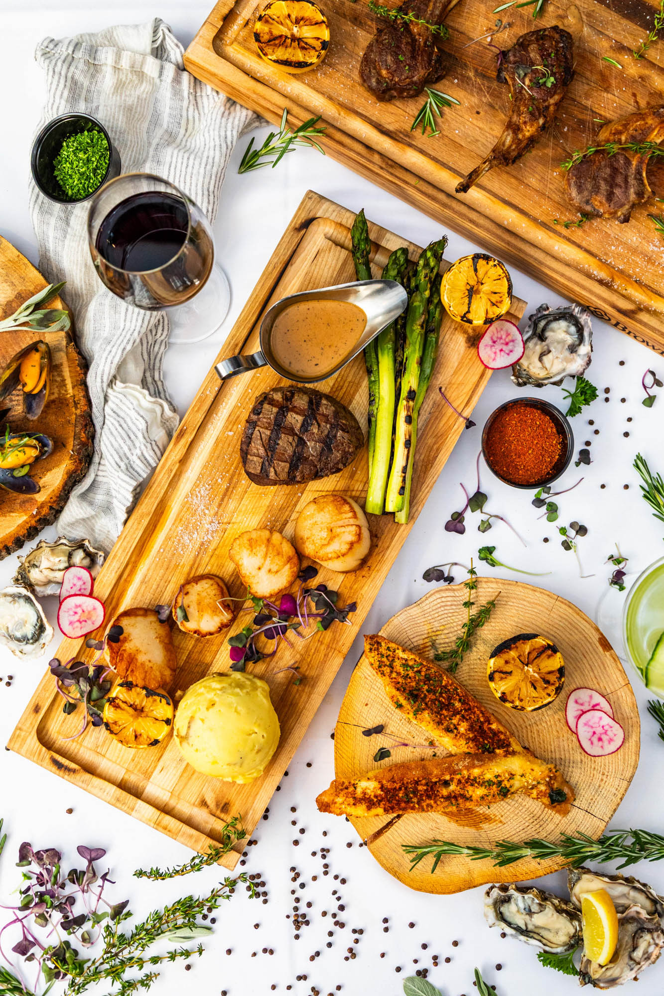 Assorted grilled dishes served on wooden boards