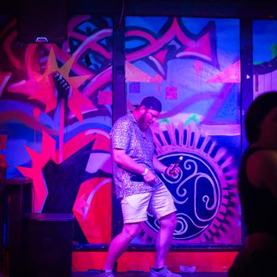 Performer dancing on stage.