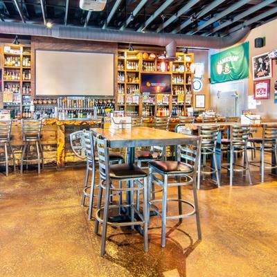 Interior, dining area, tall tables and chairs.