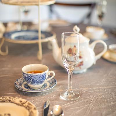 A cup of tea and a wine glass.