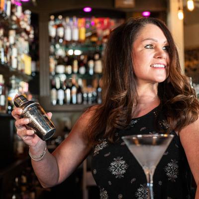 Bartender making a cocktail.