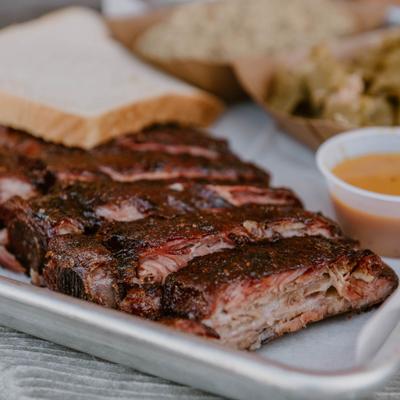 Ribs served with sides.