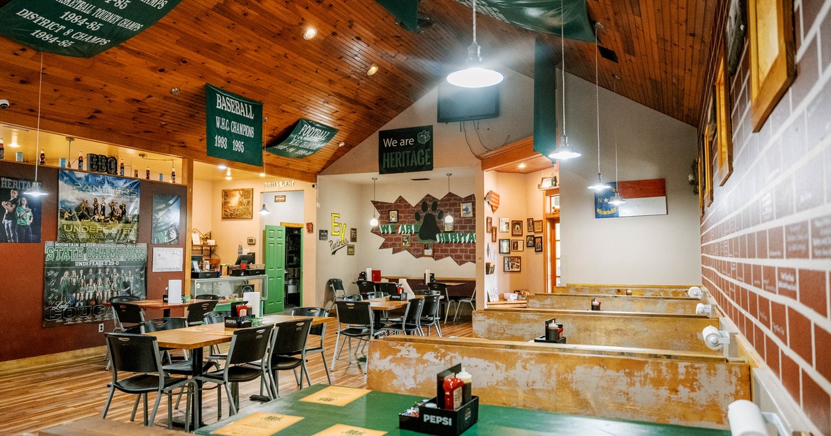 Interior seating area with chairs, tables and double booths