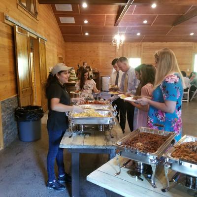 The staff serving food to guests.