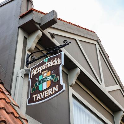 Tavern hanging sign on the building exterior.