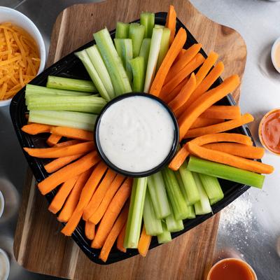 Carrots and Celery with a white sauce dip, top view