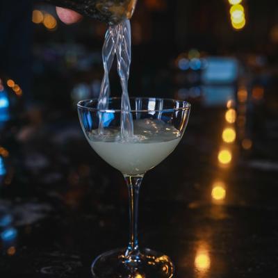 Bartender pouring a cocktail