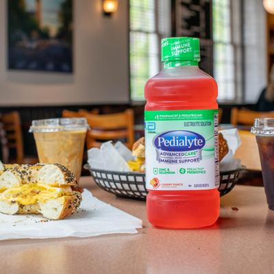 Bacon, Egg & Cheese sandwich, iced coffee and a bottle of Pedialyte Cherry Punch