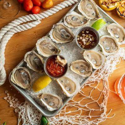 Fresh oysters with sauces.