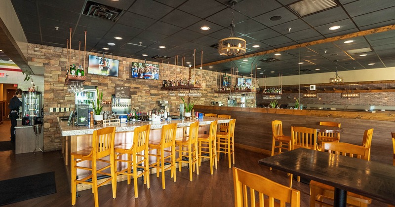 Interior, seating area with a bar and bar stools