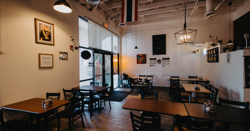 Interior with wooden tables and chairs