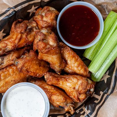 Fried chicken, red and white dip on the side
