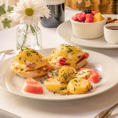 Eggs Benedict and roasted potatoes.