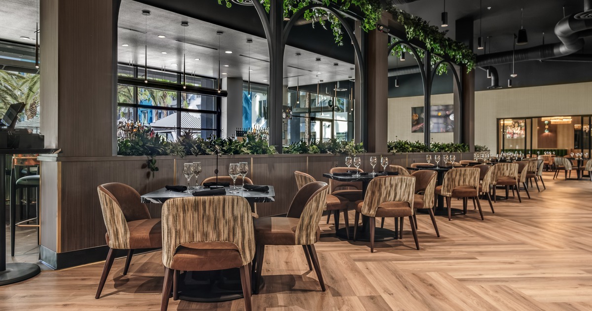 Modern style of interior design, dining area with set tables