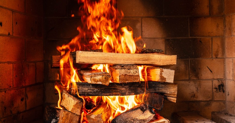 Fireplace with wood in fire
