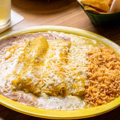 cinco de mayo dinner 3 spinach chicken enchiladas green sauce cheese beans and rice.