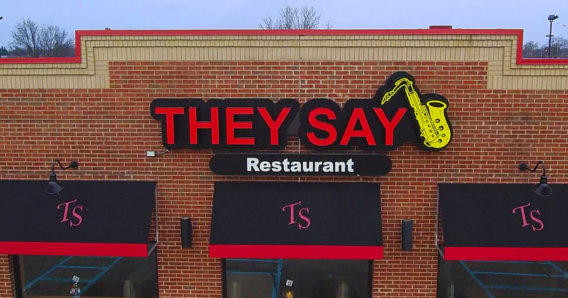 Exterior, they say restaurant entrance and sign