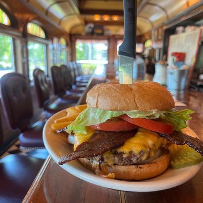 Bacon Cheddar Burger plate on a dining counter.