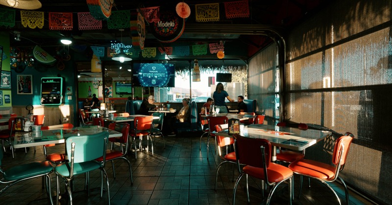 Interior, tables and chairs in seating area