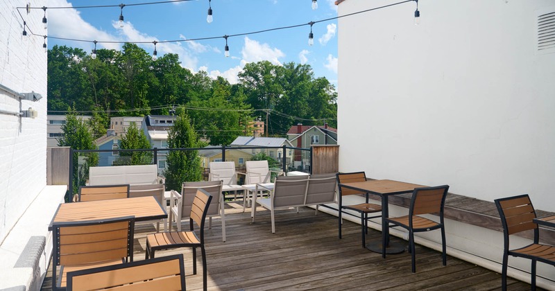 Exterior, seating area, terrace, tables and chairs, wooden decking, hanging lanterns