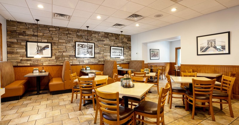 Interior, dining tables and booths, walls decorated with black and white pictures