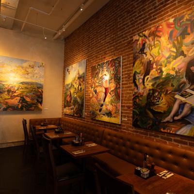 Dining room, decorated with large paintings.