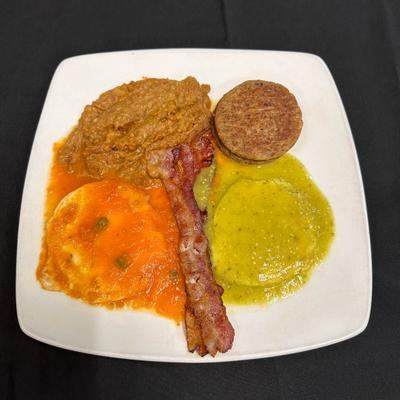 Dish with bacon and sides served on the table.