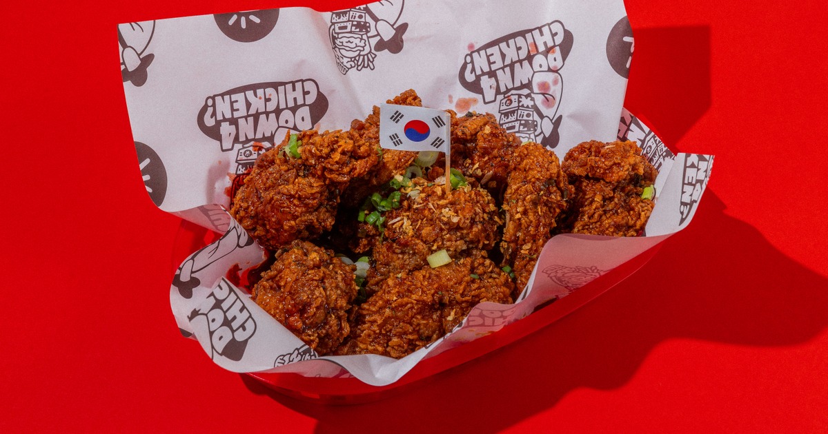 Korean fried chicken meal in paper-lined basket with a South Korean flag toothpick