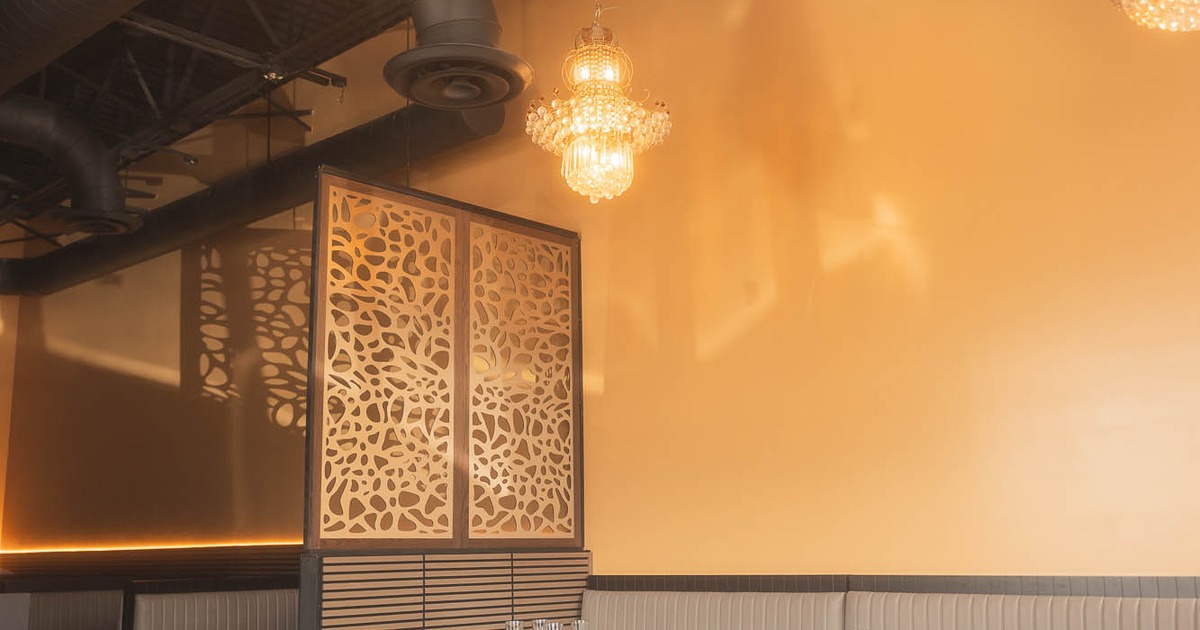 Restaurant interior with tables set for dining