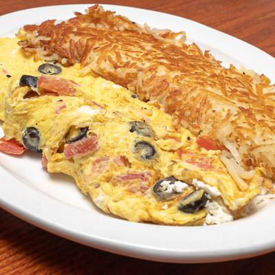 Greek Omelette, with feta, olives, tomatoes, and served with hash browns.