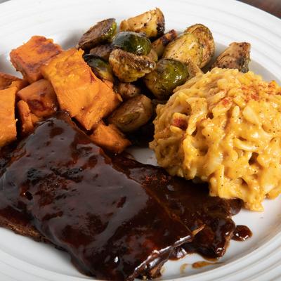 Jackfruit Ribs plate with mac and cheese and Brussels sprouts